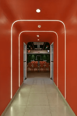 Orange arched corridor inside the SI office